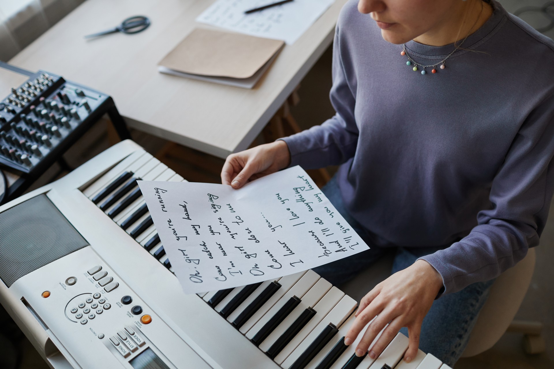 Young Woman Writing Songs Closeup